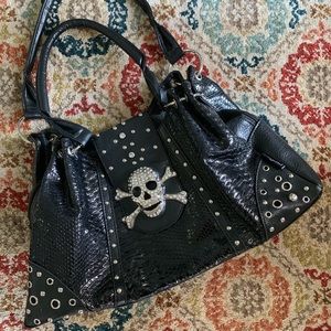 Skull studded black purse